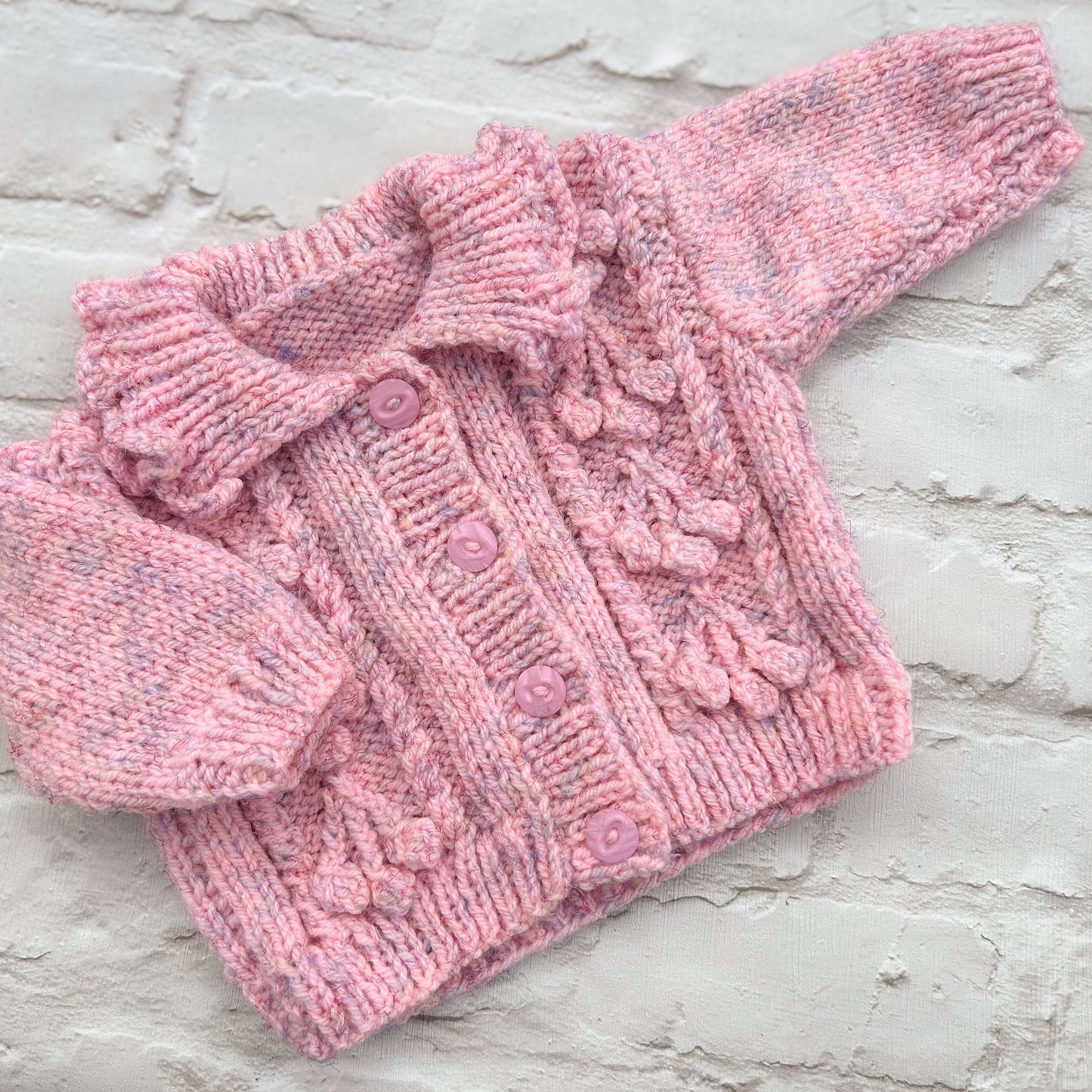 Hand knitted personalised baby cardigan in pink marl size 3-6 months — made to order in the UK | Little Name Knits
