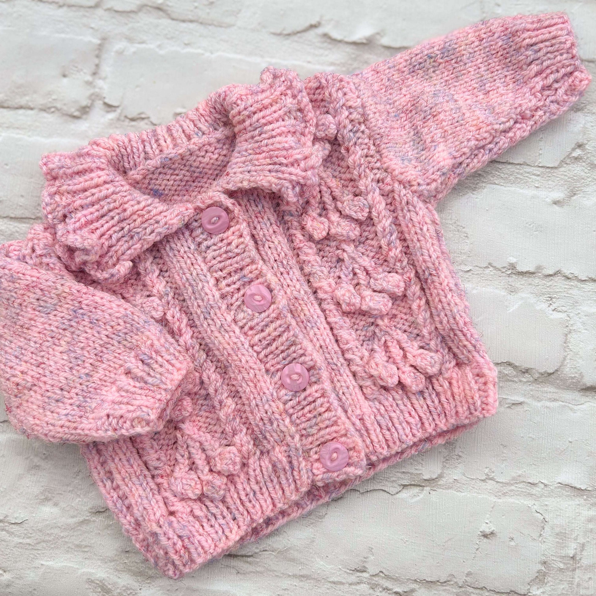 Hand knitted personalised baby cardigan in pink marl size 3-6 months — made to order in the UK | Little Name Knits