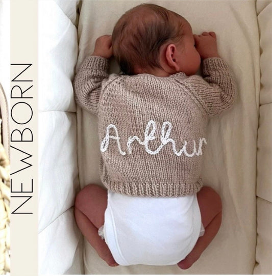 Personalised hand knitted beige baby cardigan showing embroidered name, size Newborn | Little Name Knits