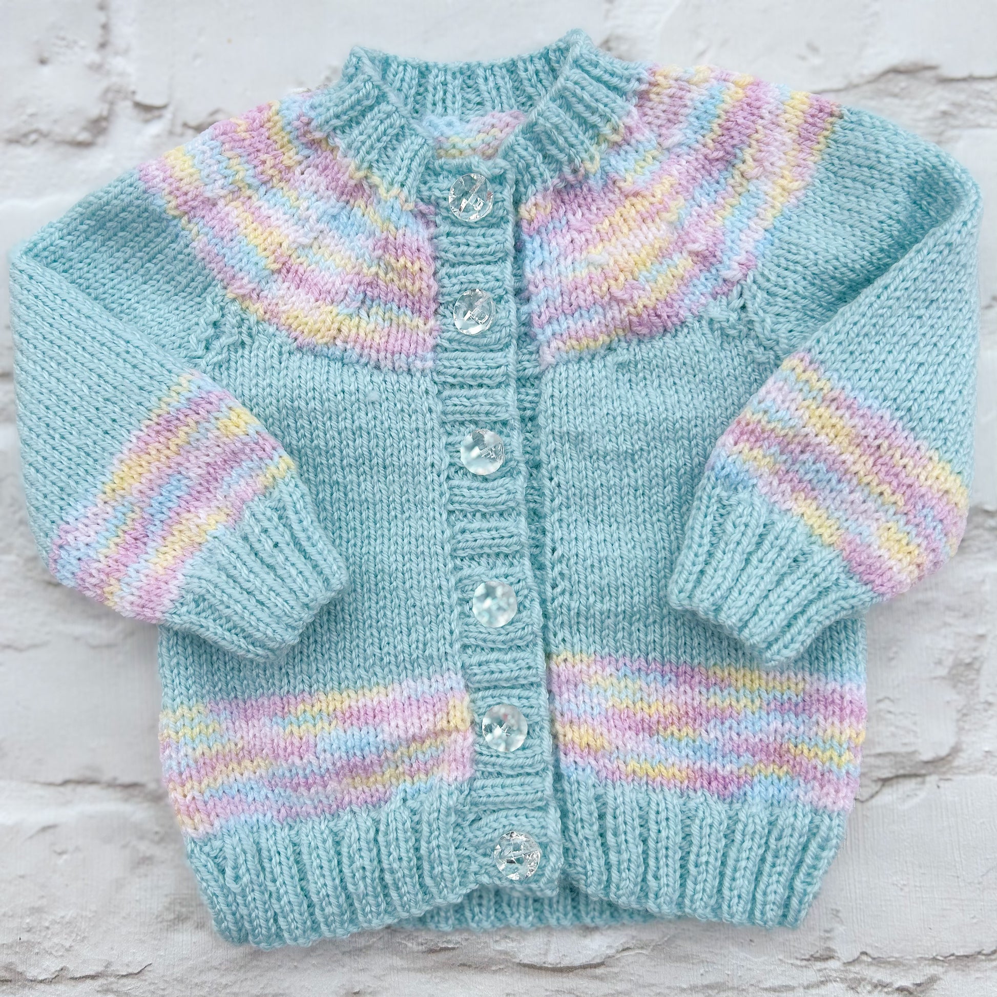Hand knitted personalised baby cardigan in aqua with coloured yoke sleeve and hem details size 0-3 months — made to order in the UK | Little Name Knits