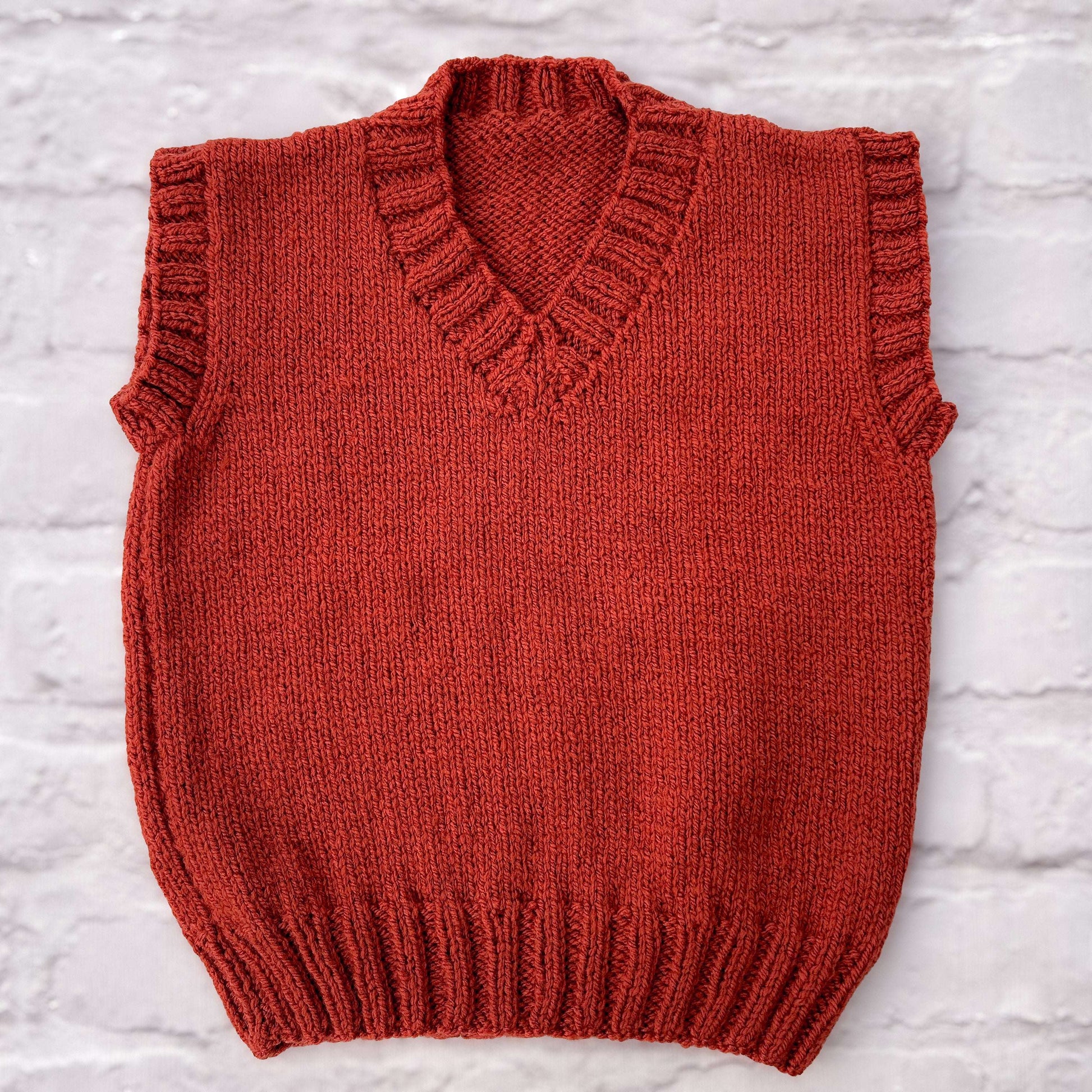 Hand knitted personalised baby tank  in rust, 18 months plus— made to order in the UK | Little Name Knits

