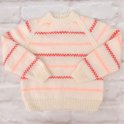 Hand knitted personalised baby cardigan in cream with peach coral detail 12-18 months — made to order in the UK | Little Name Knits