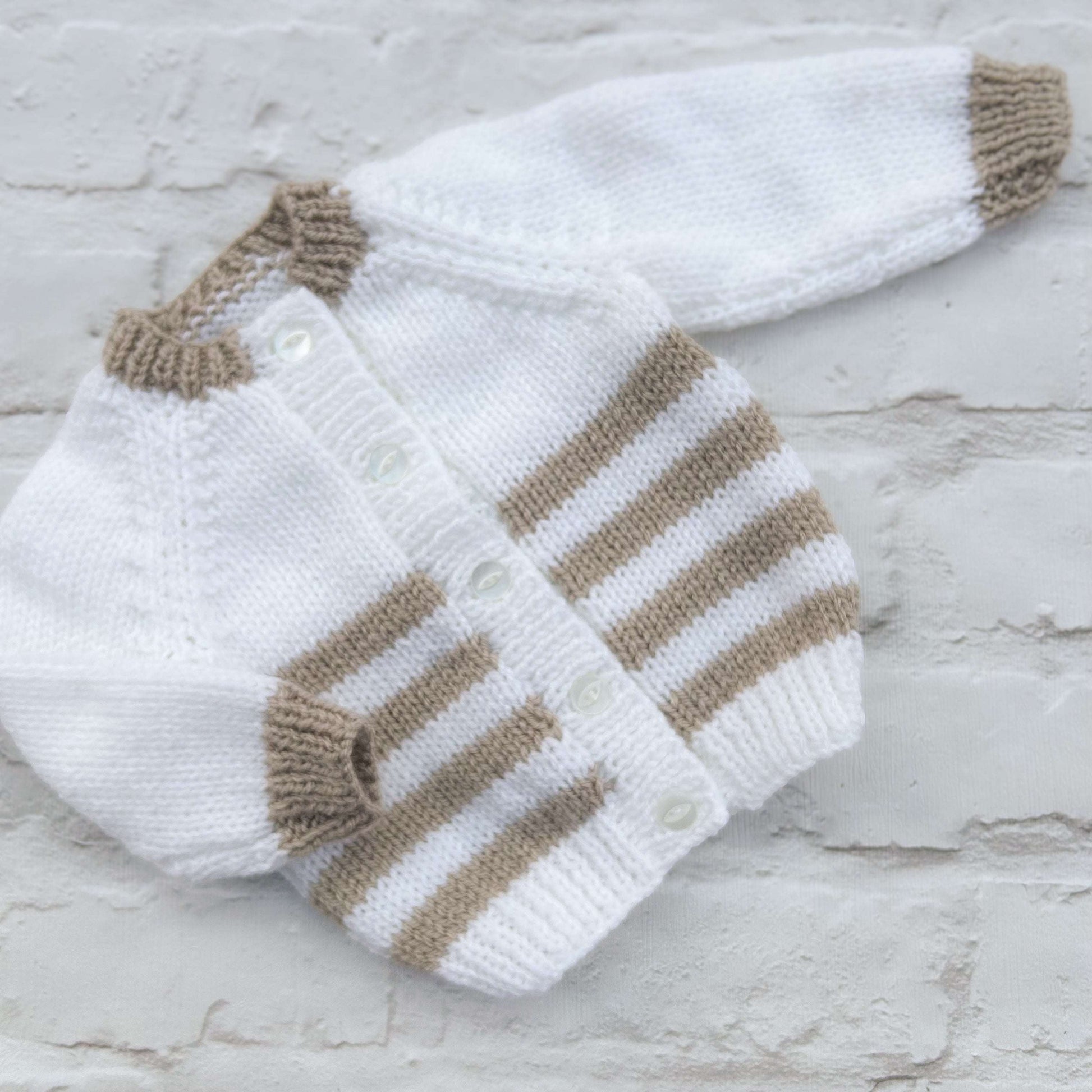Hand knitted personalised baby cardigan in white beige stripe, size 0-3 months — made to order in the UK | Little Name Knits