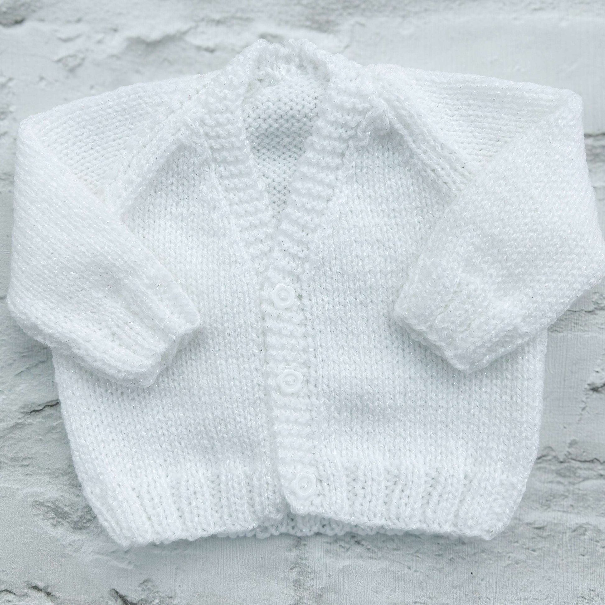 Hand knitted personalised baby cardigan in white, newborn — made to order in the UK | Little Name Knits