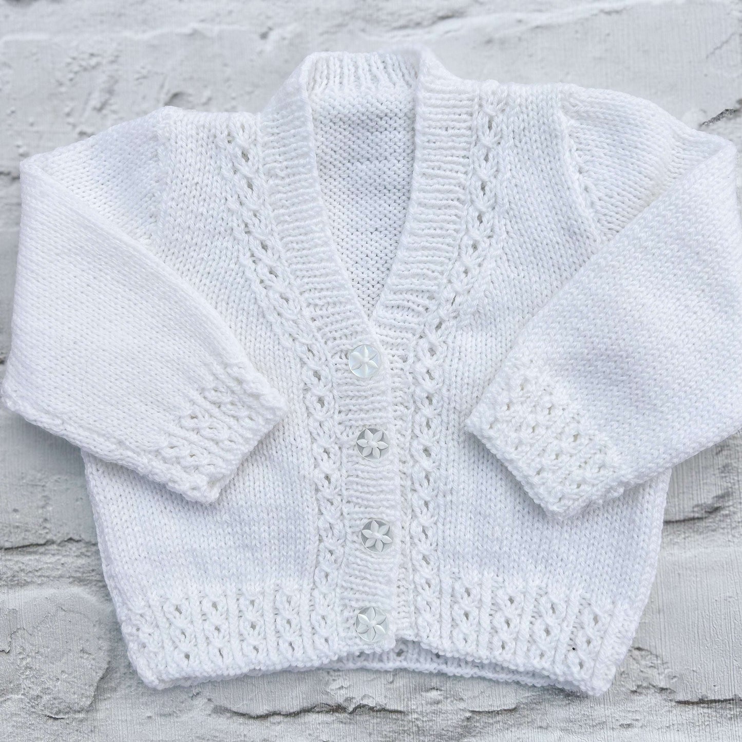 Hand knitted personalised baby cardigan in white, size 0-3 months — made to order in the UK | Little Name Knits
