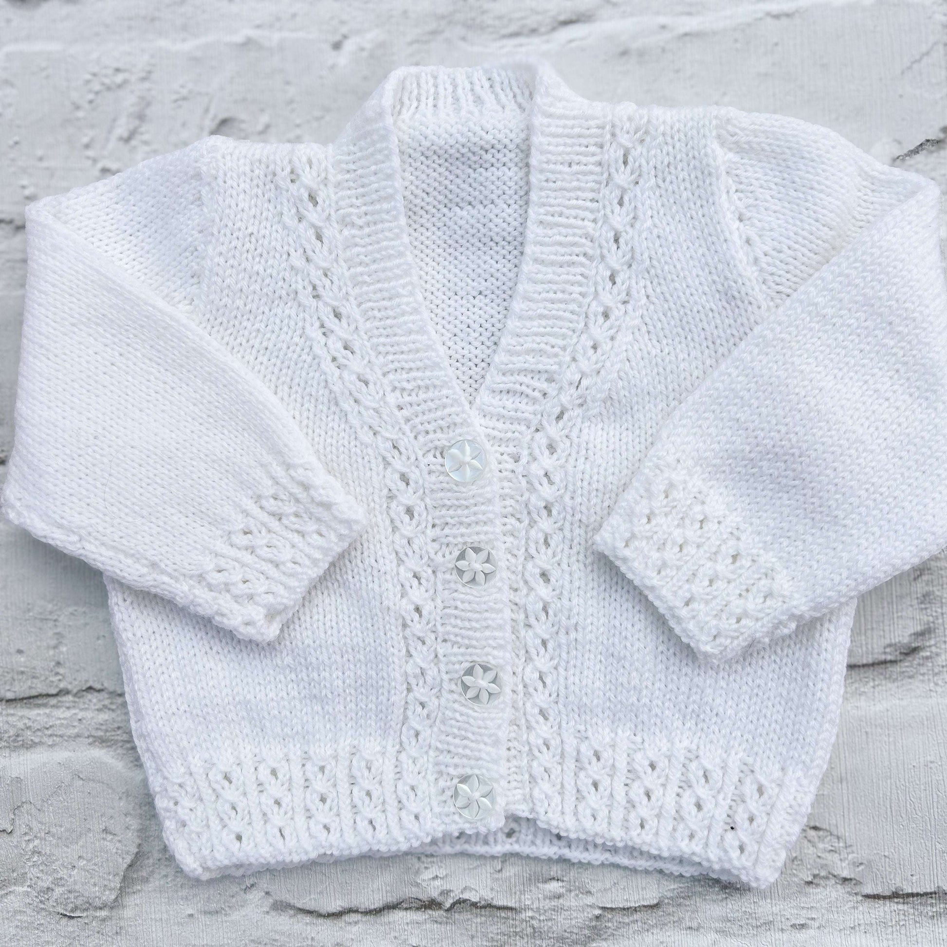 Hand knitted personalised baby cardigan in white, size 0-3 months — made to order in the UK | Little Name Knits