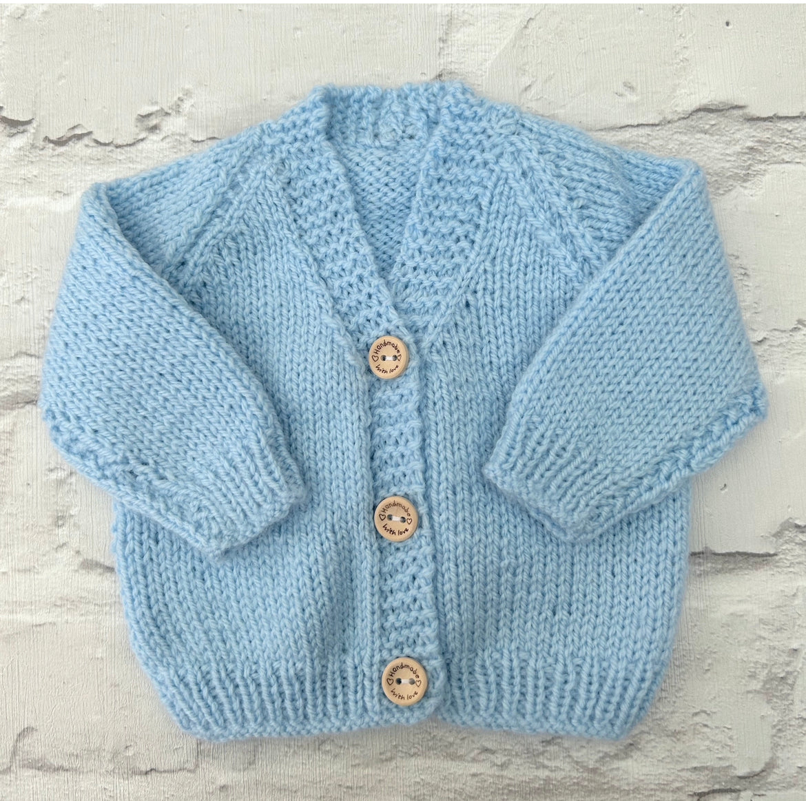 Hand knitted personalised baby cardigan in baby blue, size 0-3 months — made to order in the UK | Little Name Knits