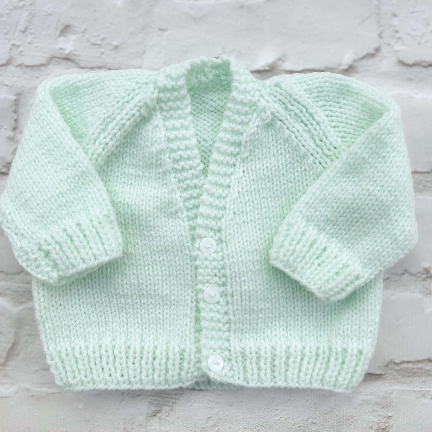Hand knitted personalised baby cardigan in mint green, size 0-3 months — made to order in the UK | Little Name Knits