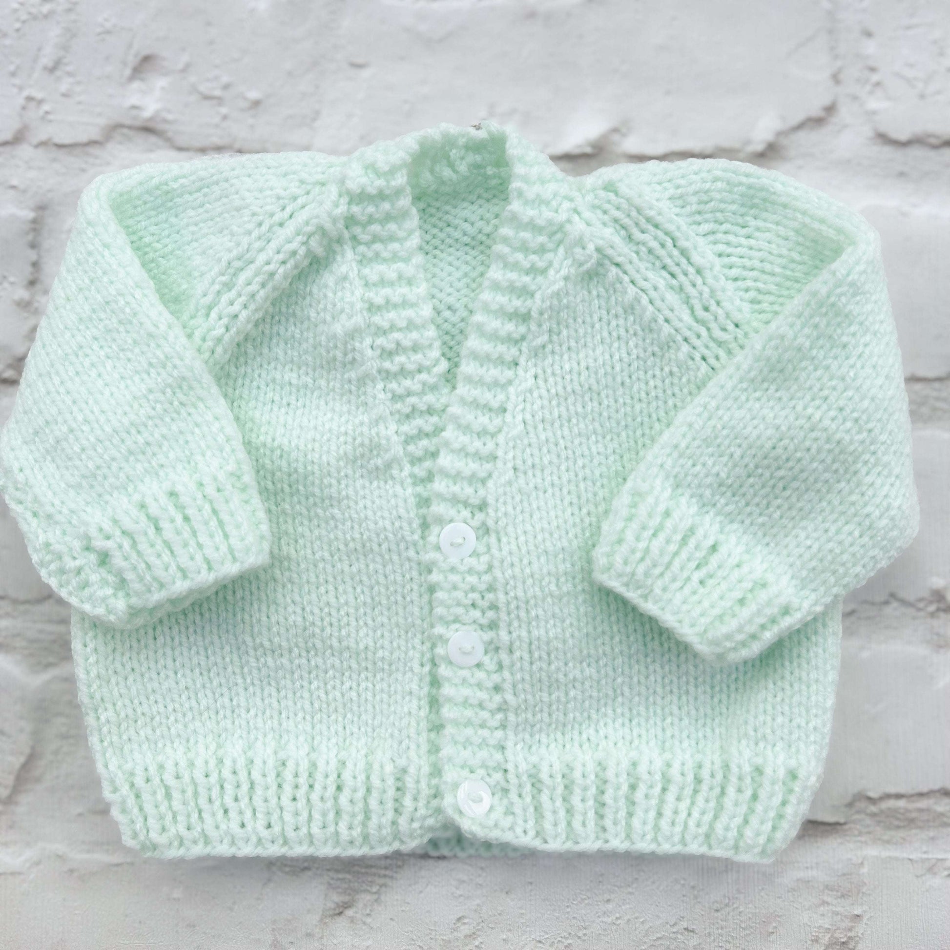 Hand knitted personalised baby cardigan in mint green, size 0-3 months — made to order in the UK | Little Name Knits