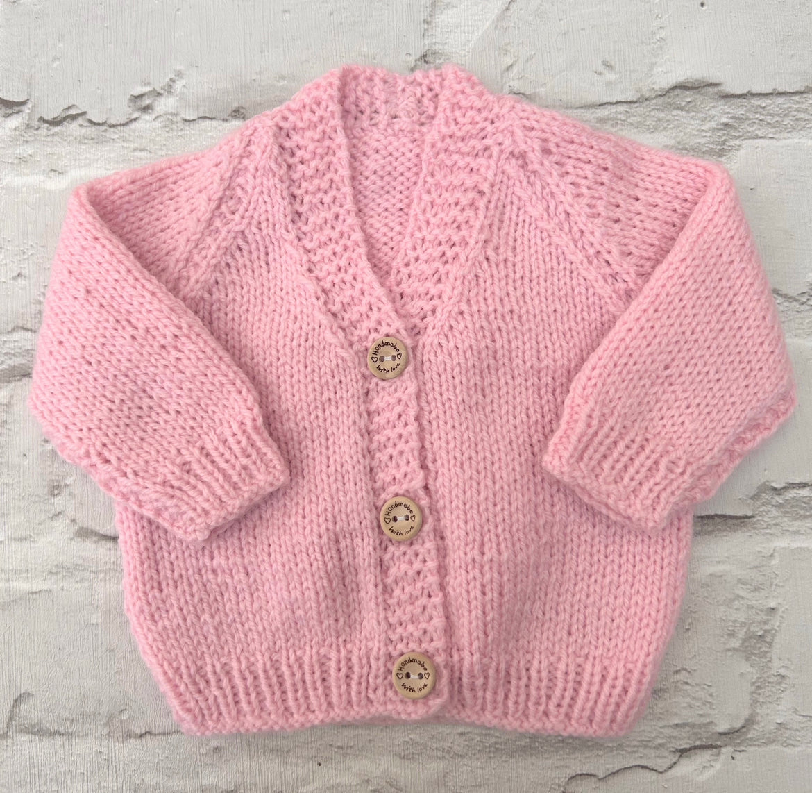 Hand knitted personalised baby cardigan in baby Pink, newborn made to order in the UK | Little Name Knits