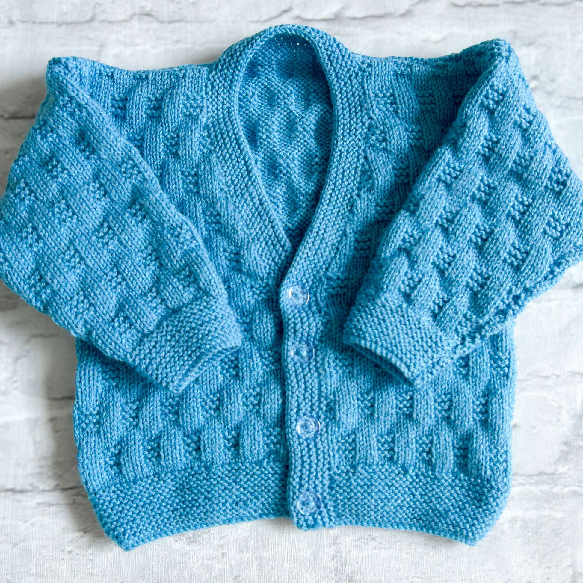 Hand knitted personalised baby cardigan in blue, 18 months plus (2-3 years)— made to order in the UK | Little Name Knits

