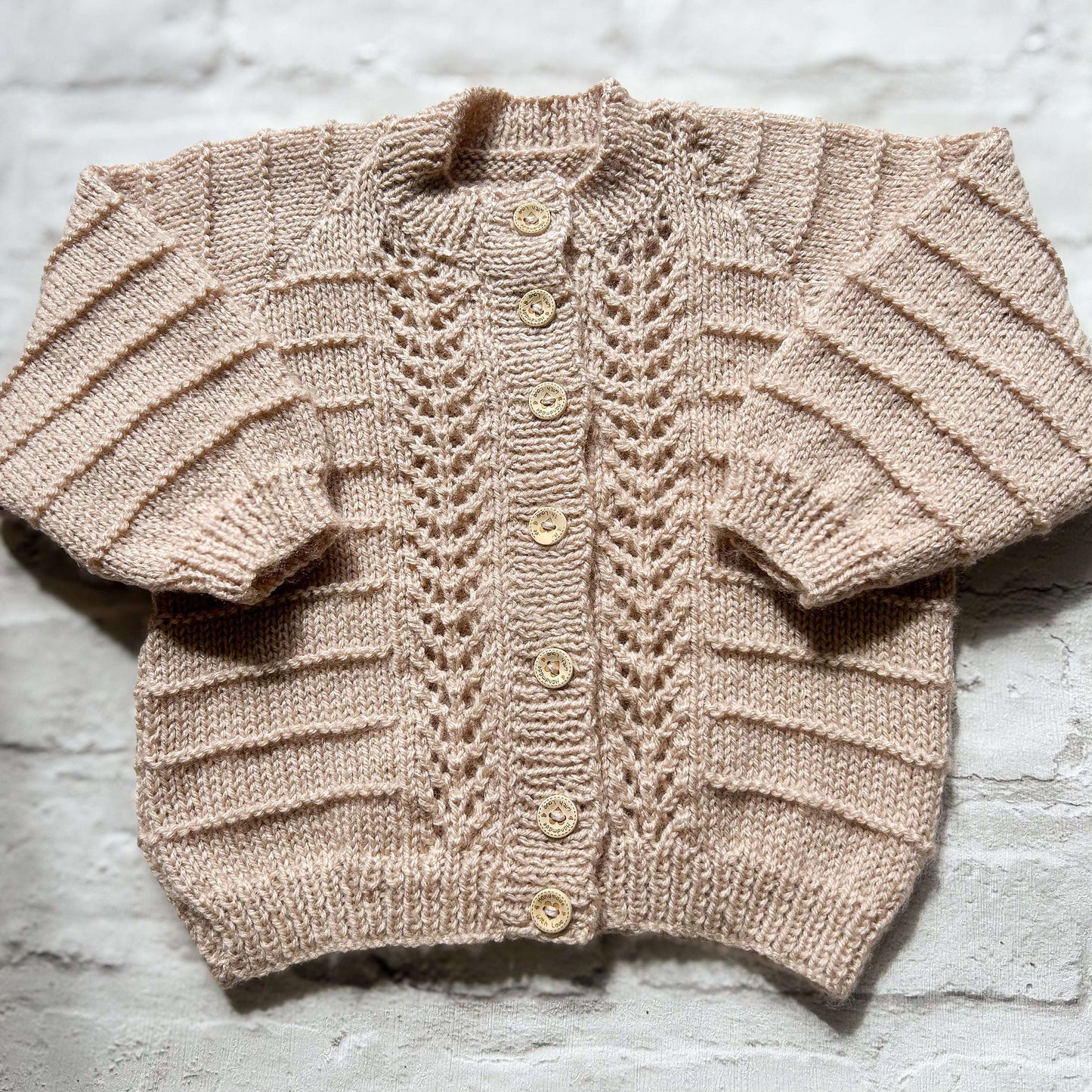 Hand knitted personalised baby cardigan in beige detail 12-18 months — made to order in the UK | Little Name Knits