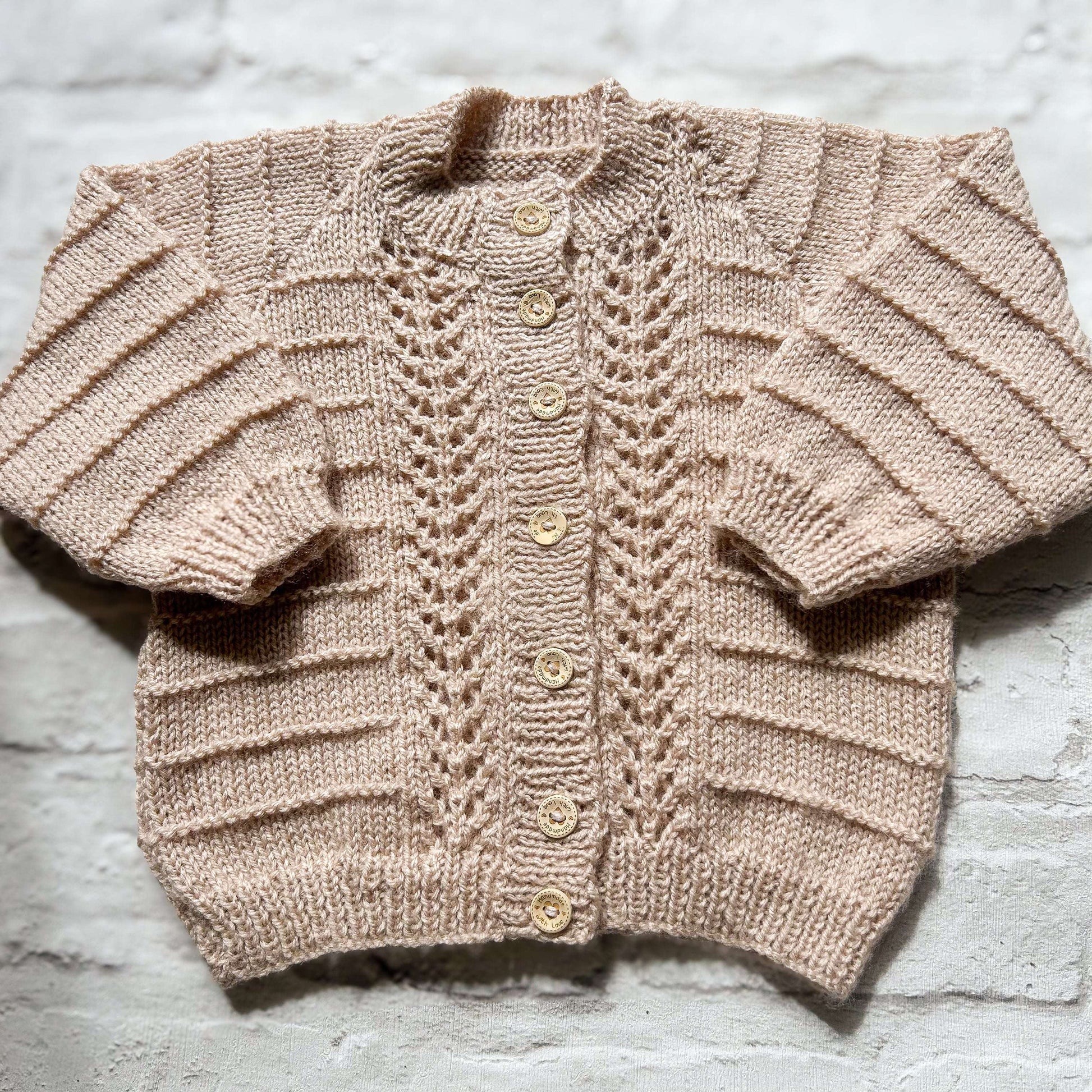 Hand knitted personalised baby cardigan in beige detail 12-18 months — made to order in the UK | Little Name Knits