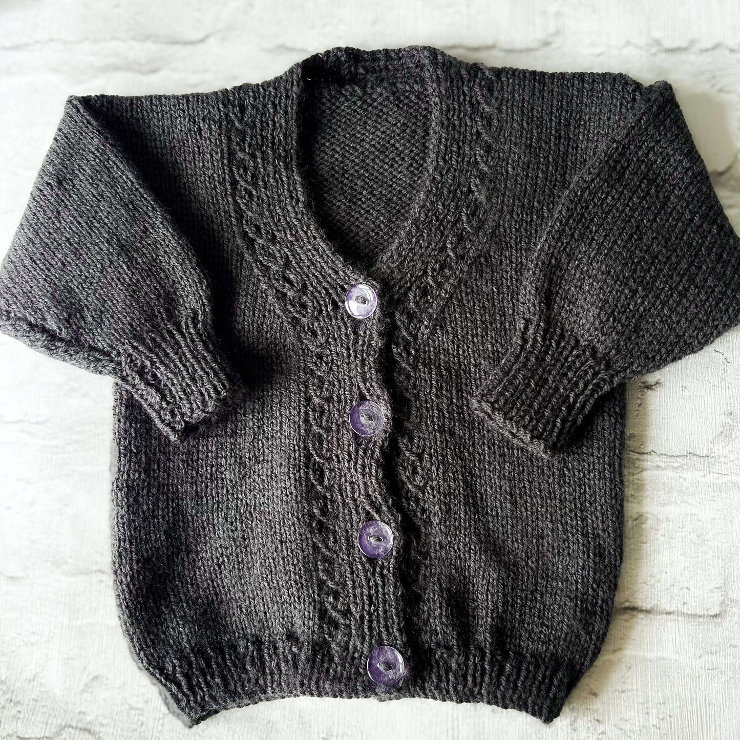 Hand knitted personalised baby cardigan in ink blue size 3-6 months — made to order in the UK | Little Name Knits