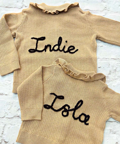 Hand embroidered personalisation on 'H&M' cardigans matching for siblings. Send in service by Little Name Knits - add name to your own knitwear hand knitted or store purchased knitwear