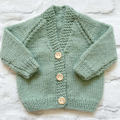 Hand knitted personalised baby cardigan in sage green, size newborn  — made to order in the UK | Little Name Knits