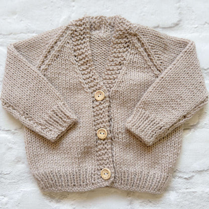 Hand knitted personalised baby cardigan in beige shade called 'latte' in size 0-3 months — made to order in the UK | Little Name Knits