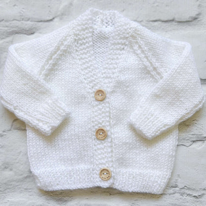 Hand knitted personalised baby cardigan in white, size newborn  — made to order in the UK | Little Name Knits