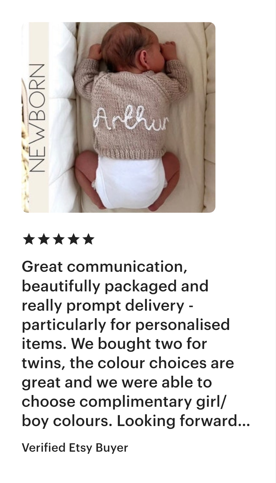 Newborn baby in a hand knitted sweater with 'Arthur' on it, lying on a white blanket. with 5 star review text from a customer