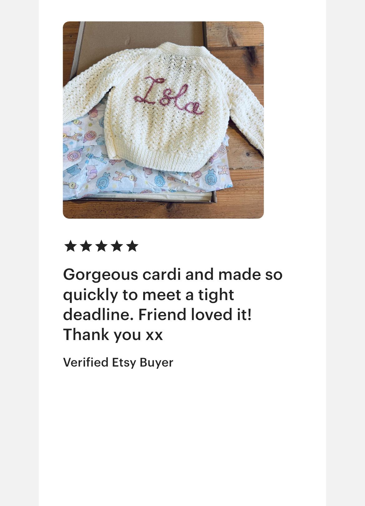 hand Knitted cardigan with 'Isla' hand embroidery, with a five-star rating and customer review text.