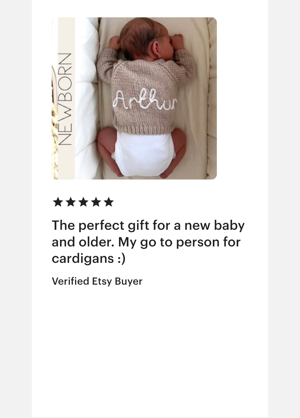 Baby wearing a hand knitted cardigan with 'Arthur' hand stitched onto it, with a five star product review from verified etsy buyer