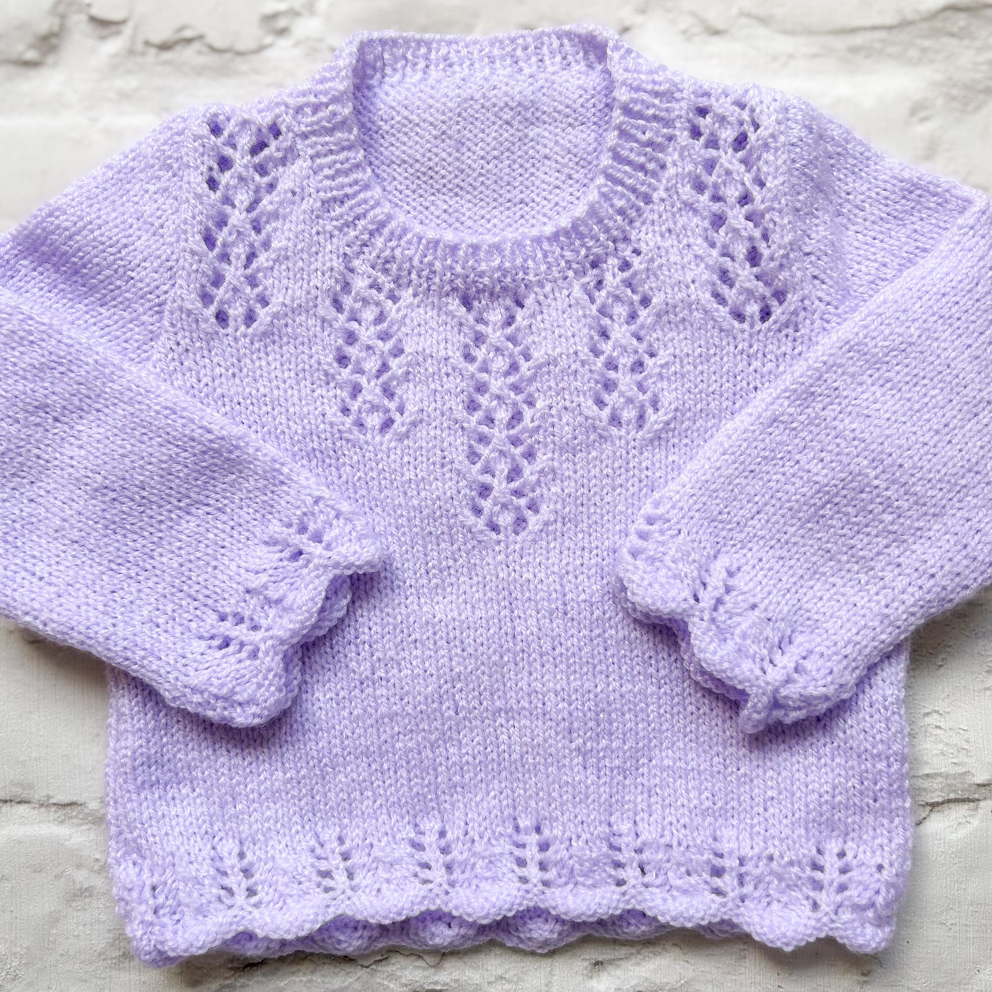 Hand knitted personalised baby jumper in lilac, size 0-3 months — made to order in the UK | Little Name Knits