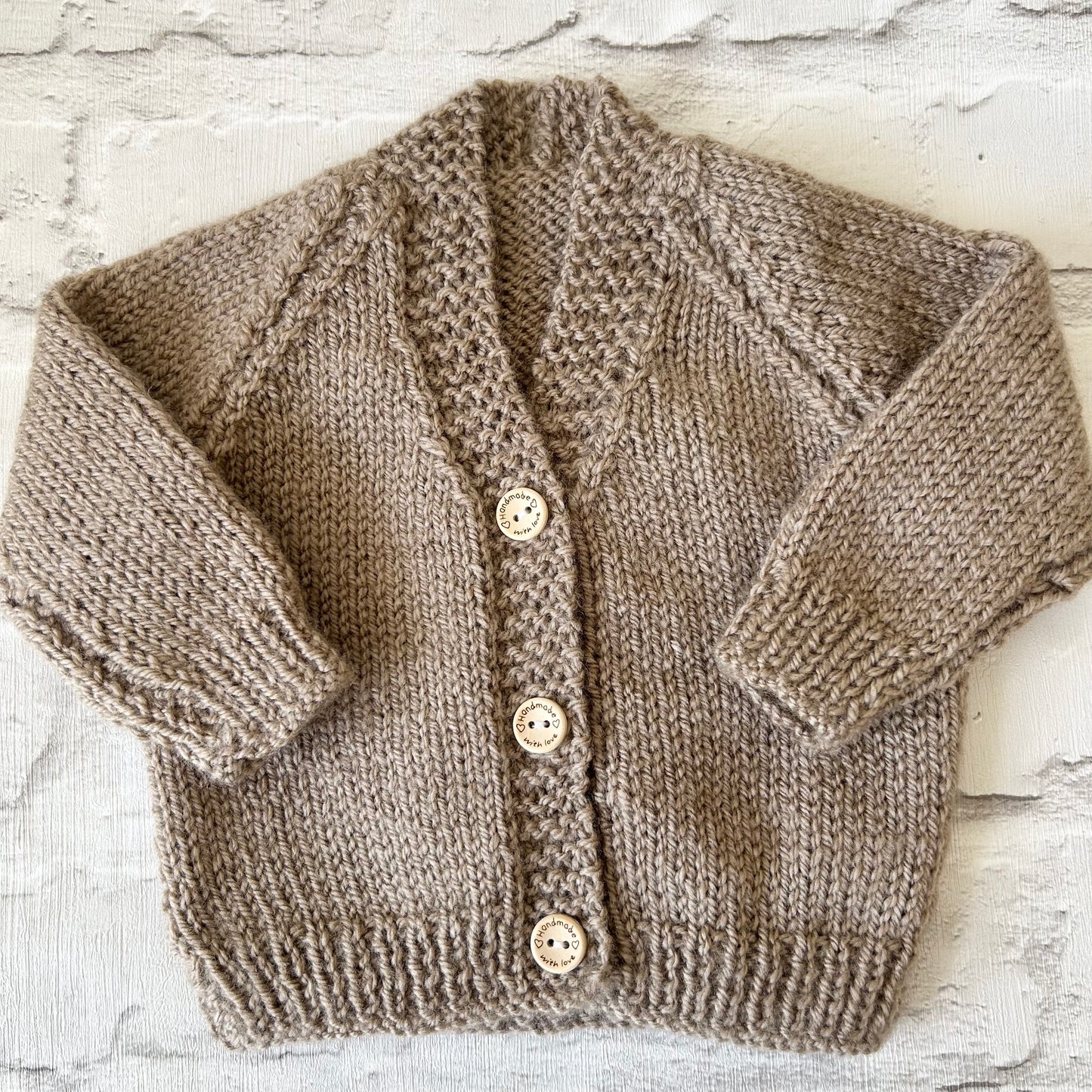 Hand knitted personalised baby cardigan in fawn brown size 0-3 months — made to order in the UK | Little Name Knits